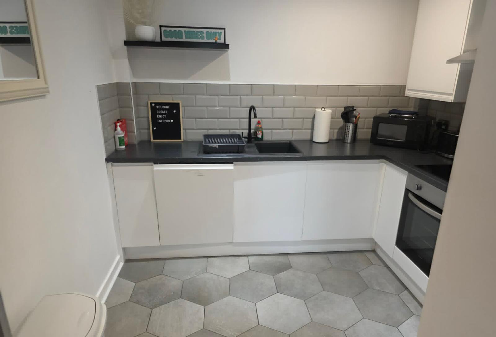 Clean kitchen with hexagonal tiles